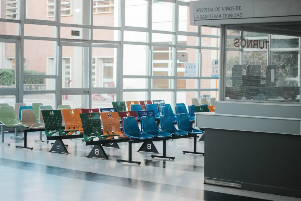 Bright, clean clinic waiting area with rows of seating