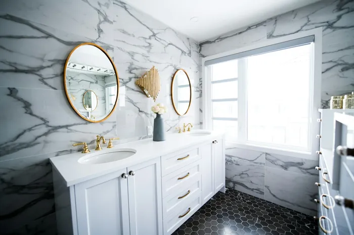Clean, modern washroom with marble finishes